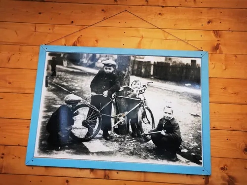 Old picture of children with bike in Poland